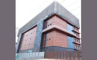 An exterior photo of Techno Digital's new Chennai data center is shown.
