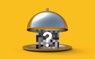 An open cloche revealing a pixelated box with a question mark over it.
