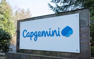An outdoor sign featuring the blue Capgemini logo.