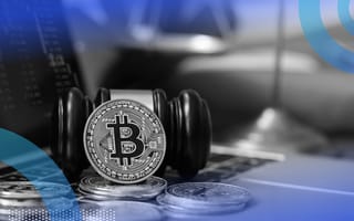 Bitcoin, gavel and a computer showing crypto trends
