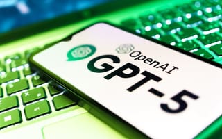 GPT-5 on a smartphone screen resting on a laptop keyboard