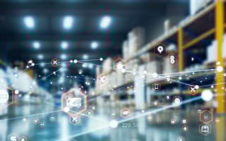 Blurred warehouse background with connected digital icons, including transportation, shopping, and data symbols, conveying a futuristic logistics network.