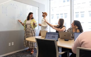 Braze team members brainstorm ideas on a whiteboard at the company’s NYC office
