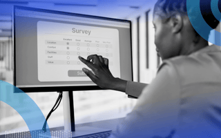 An employee completes a survey on a monitor