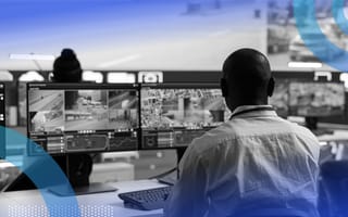 An AI-enhanced command center with workers on desktop screens