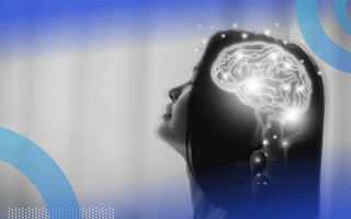 An illuminated brain in a woman's head