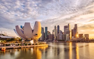 A photo of the Singapore skyline in the Marina Bay area at sunset.