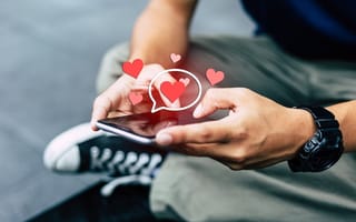 A person texts love-related messages on a smartphone.