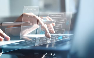 Hands typing on a laptop with floating digital contact forms and icons overlaying the scene, suggesting technology and communication.