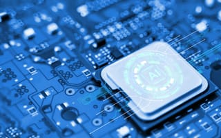 A close-up image of a blue circuit board highlights a central chip labeled "AI," symbolizing advanced technology and artificial intelligence innovation.