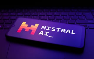 The Mistral AI logo appears on the screen of a smartphone