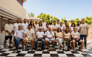 A group photo of the Second Nature team is shown.