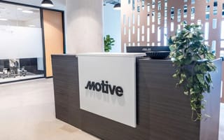 The front desk at Motive's Austin office is shown.