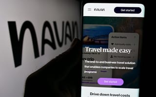 A hand holds a mobile device with the text "Travel made easy" on the screen and the Navan logo in the background of the image.