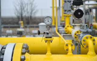 NovaAir Expands Indian Reach Through Acquisition by Air Liquide Close-up of a pressure gauge on bright yellow gas pipelines at an outdoor facility. The overcast sky and blurred background create an industrial feel.