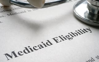 Findhelp Acquires Uno Health to Modernize Access to Public Benefits Stethoscope on document titled "Medicaid Eligibility," highlighting healthcare accessibility.
