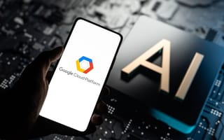 Google Cloud Platform logo on a mobile device held over the letters AI