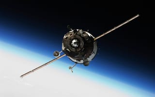 A satellite orbits Earth against a stunning backdrop of blue and white. Its metallic surface and extended solar panels reflect sunlight in space.