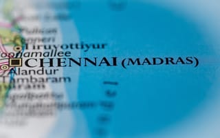 Close-up of a map highlighting Chennai, formerly Madras, in bold text. Nearby are smaller location names, with a blue background indicating ocean.