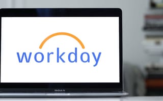 The Workday logo on the monitor of a laptop computer.