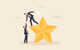 An illustration of a businessman standing on top of a star while reaching down to help another businessman climb to the top of the star