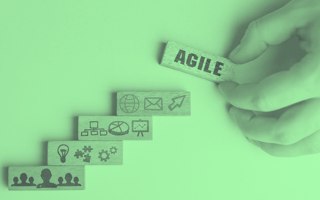 Wooden blocks with symbols, the top one says "agile".