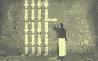 3 Product Management Principles Every PM Should Implement Now Person drawing arrow in different direction from others on a wall.