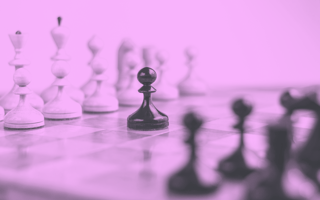 Pawn piece in the middle of a chess board.