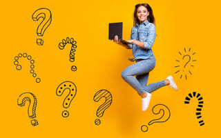 9 Common Coding Interview Questions You Should Know happy woman with laptop