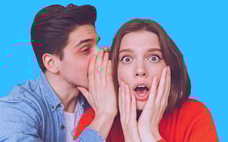 Man whispering a secret to a woman, sharing information