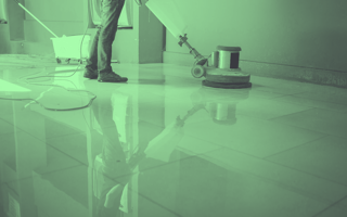 A janitor waxes a floor