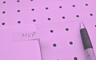 A pen and pad with notes on an MVP