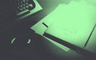 4 Methods and Tools for Enhanced Privacy in a Digital Age A classified folder sits next to a keyboard and mouse
