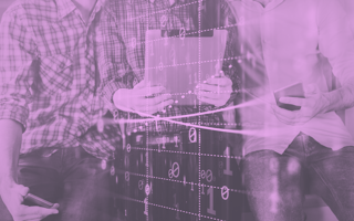 Three people look at a chart with a binary overlay