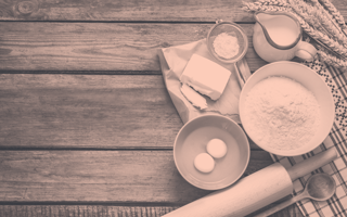 Eggs, flour, butter, a rolling pin, and other baking ingredients
