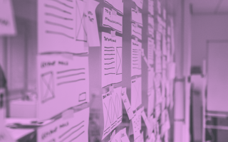 A wall with UX designs pasted up