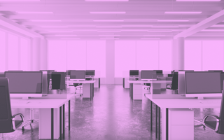 Office with rows of empty desks.