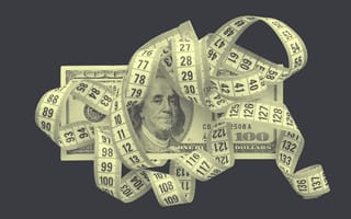 Measuring tape on top of a $100 bill.