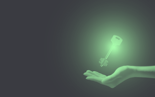 Outstretched hand under a floating key that is lit up.