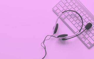 Headset laying on a keyboard.