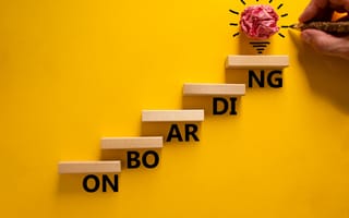 Wooden blocks positioned as stairs, onboarding new users