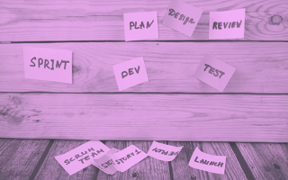 Post-its with various words associated with agile and development.
