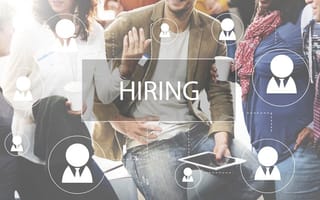 How to Write a Job Description: A Recruiter’s Guide people collaborating with hiring label over top