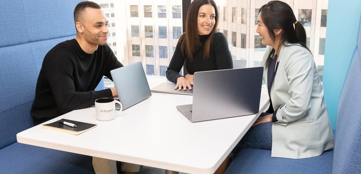 coworkers talking at a table