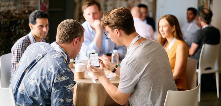 Photo of the Upside team working together at a table.