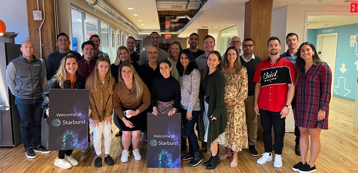 Starburst's team posing for a photo in their office.