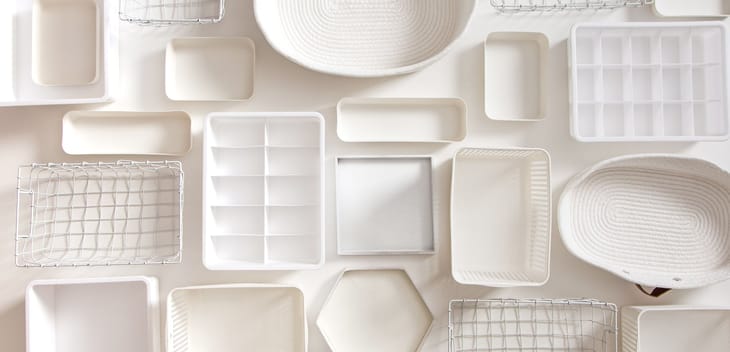 A flat lay photo of clean white storage objects