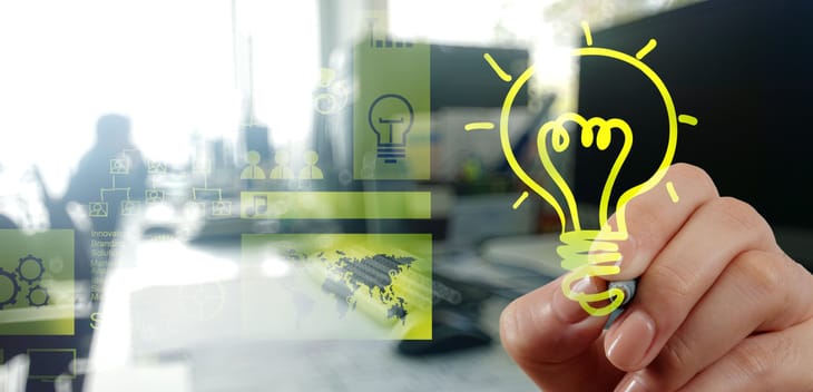 Innovation concept: hand drawing light bulb with office interior background.