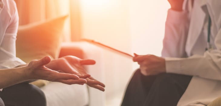 A patient talks with a therapist.