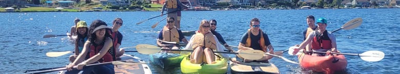 Group of people from Clean Power Research kayaking on Lake Sammamish